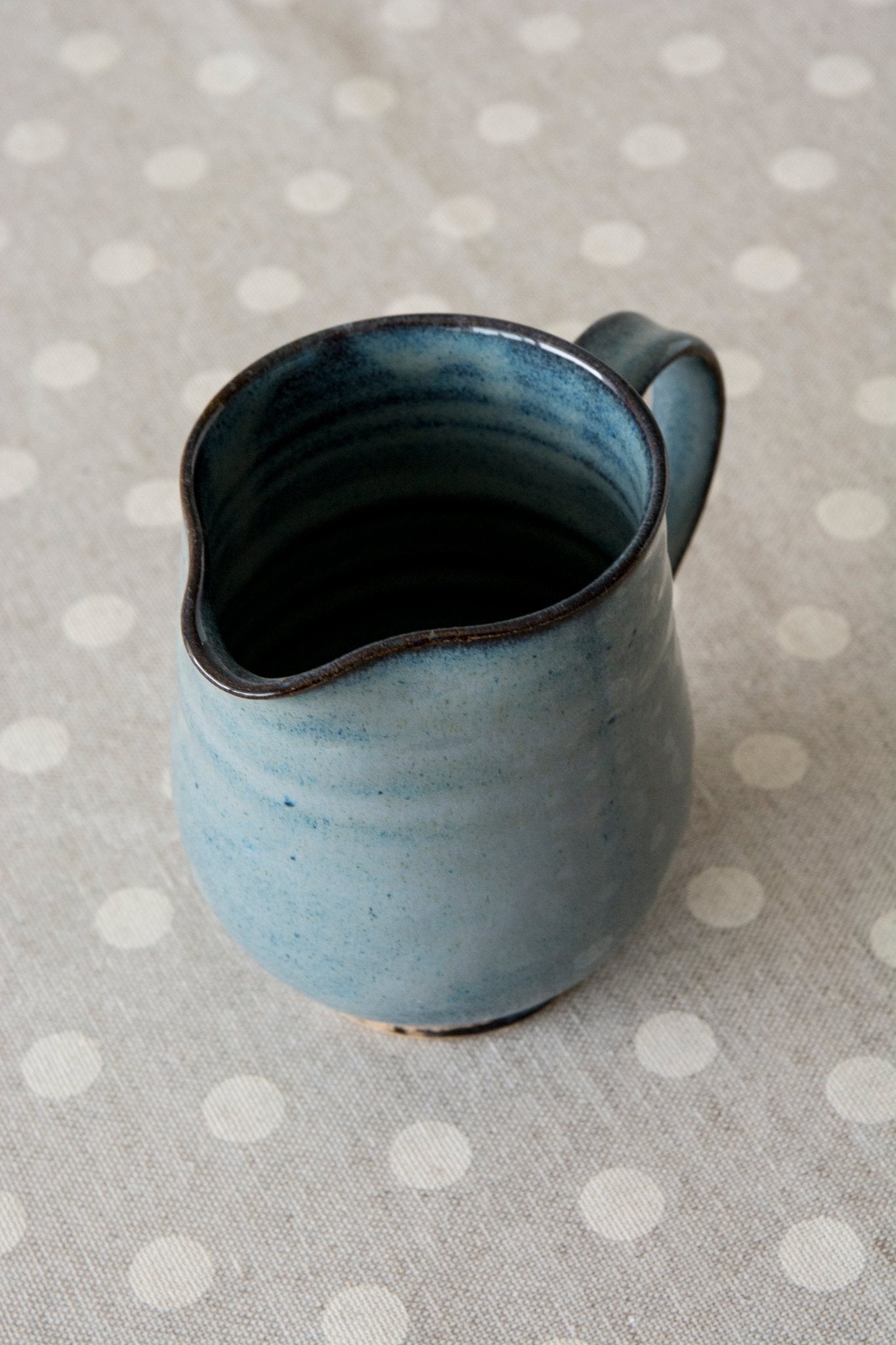 Small stoneware jug with handle, ideal for coffee or tea